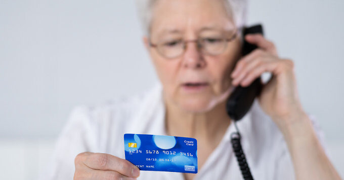 Lady on phone with credit card