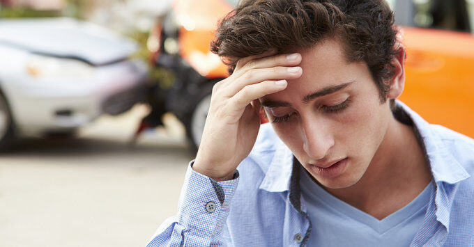 Teenager contemplating the accident he was in.